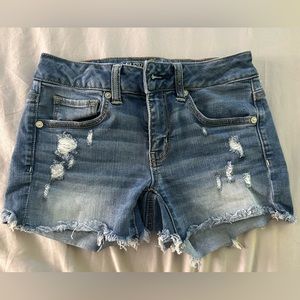 American Eagle Outfitters ripped MIDI shorts.